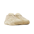 Tan Reebok sneakers with textured sole and modern layered detailing, premium footwear