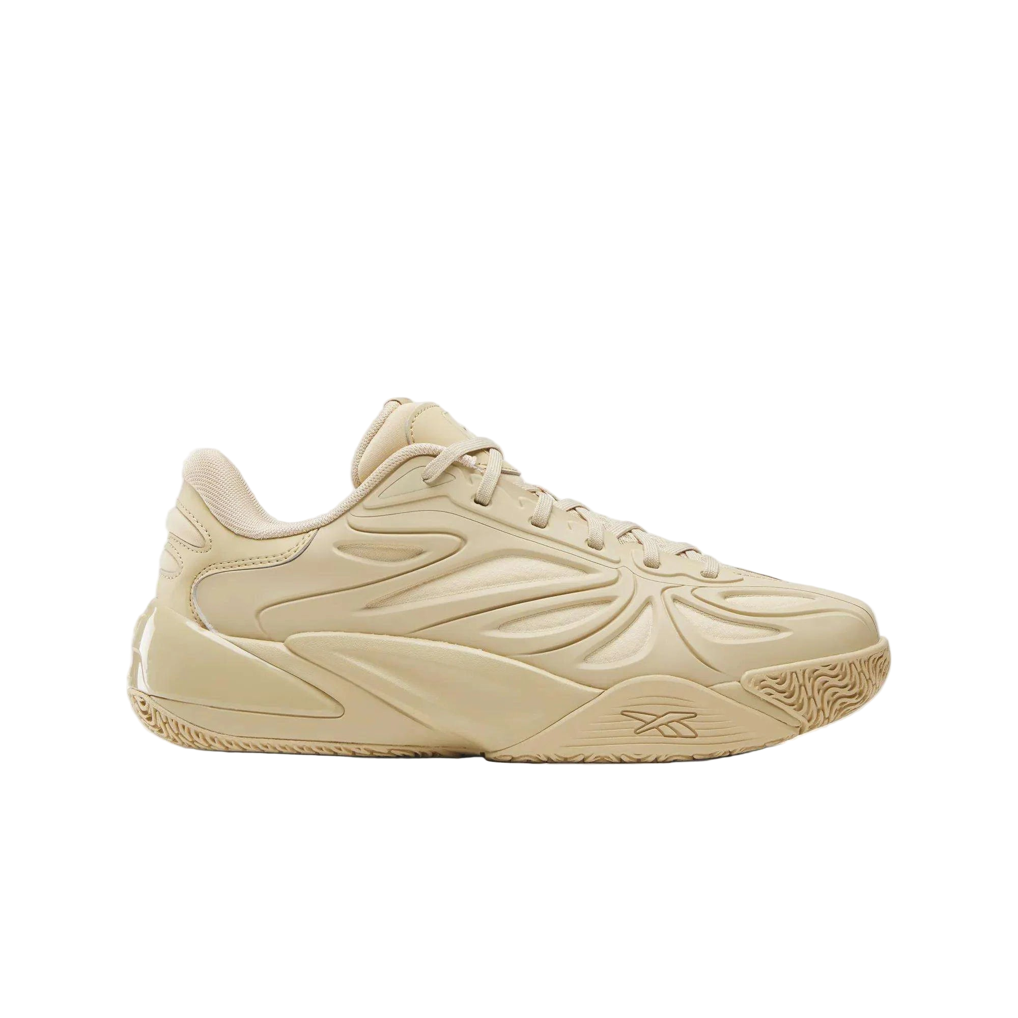 Tan Reebok sneaker with textured design, footwear for sneaker enthusiasts