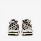 Rear view of silver and white ASICS sneakers with mesh details, ideal athletic footwear