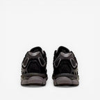 Back view of black ASICS sneakers with mesh and suede detailing, footwear for men