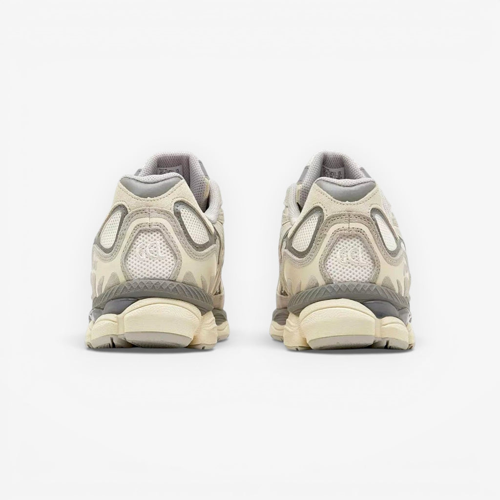Rear view of beige ASICS sneakers with mesh and suede details, neutral background, footwear