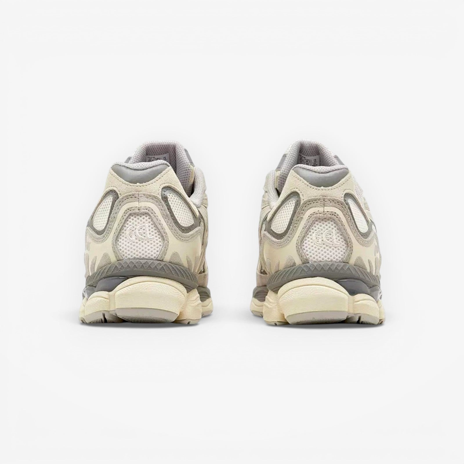 Rear view of beige ASICS sneakers with mesh and suede details, neutral background, footwear
