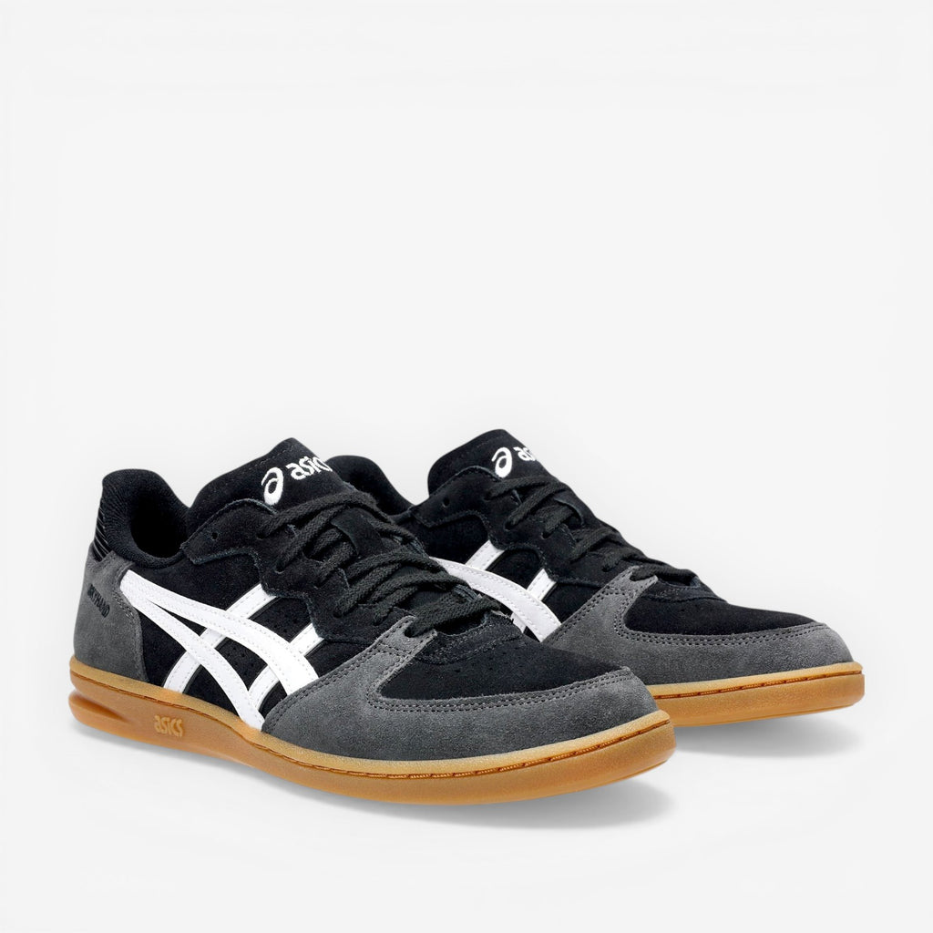 Black and gray sneakers with white logo on a white background
