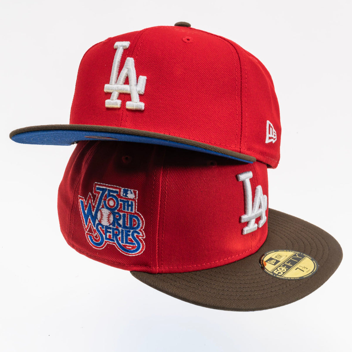A red Los Angeles Dodgers 2022 World Series cap by New Era, featuring a brown visor, white embroidered 'LA' logo, and a blue and white '2022 World Series' patch on the front.