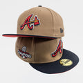 A New Era Atlanta Braves championship baseball cap in khaki and navy blue, featuring the team's 'A' logo and a 'Champions' patch on the side.
