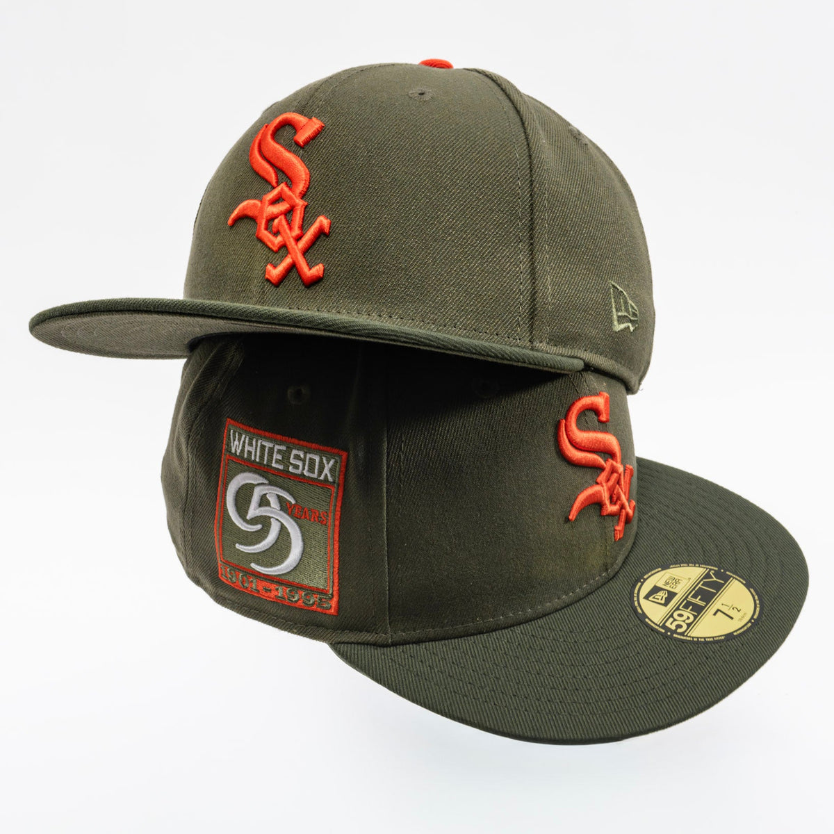 An olive green New Era White Sox 59FIFTY fitted cap with orange embroidered 'SOX' logos on the front and side, a white and orange White Sox patch on the side, and a gold size sticker on the brim, set against a plain white background.