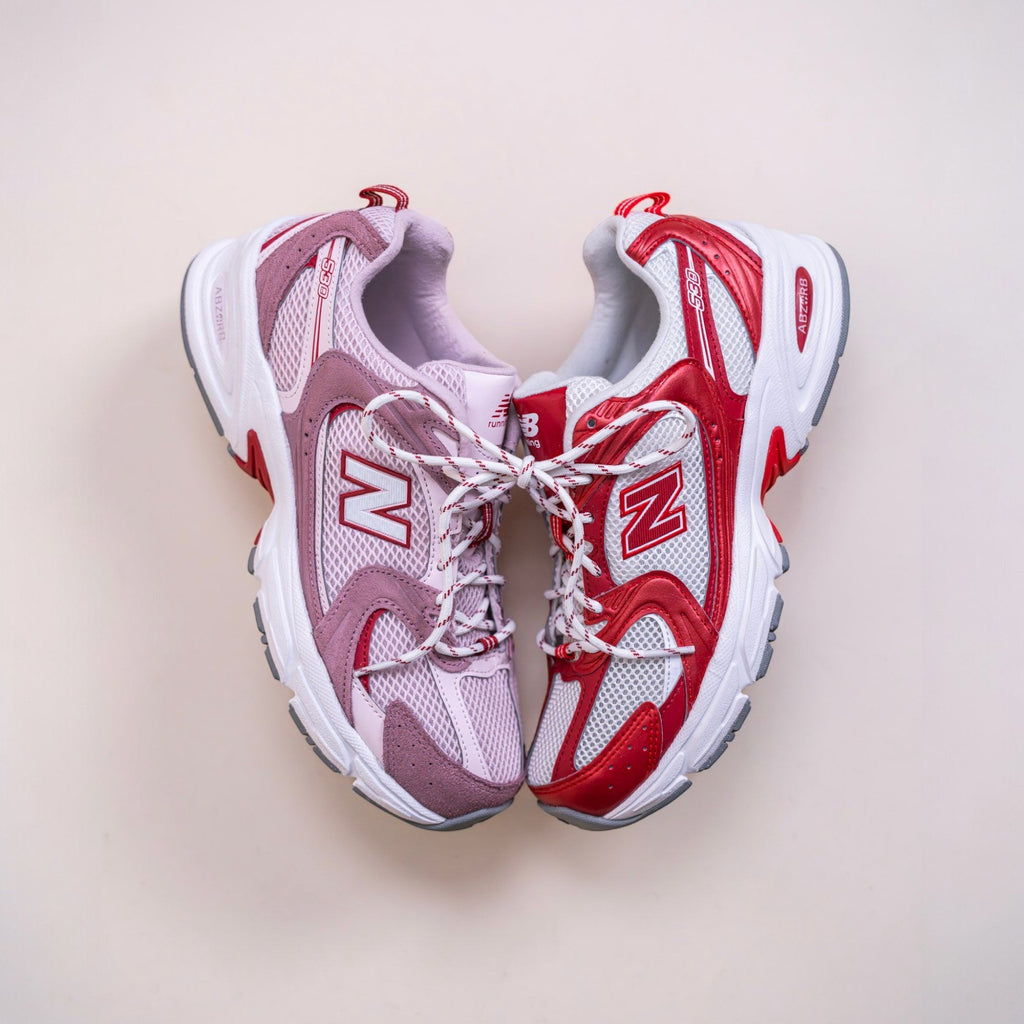New Balance 530 running sneakers in red, white, and lavender with mesh and suede details