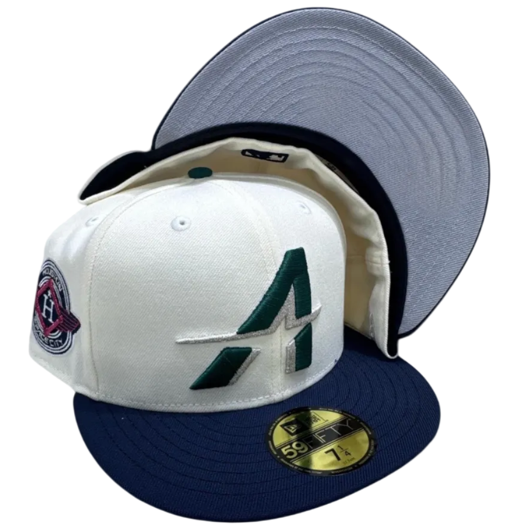 New Era fitted cap with white crown, navy brim, embroidered logo, sneaker-inspired accessory