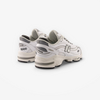 New Balance 1000 white sneakers, mesh and leather footwear, side and back view