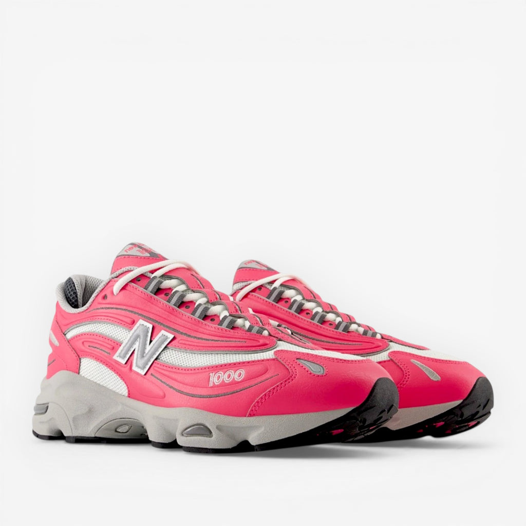 New Balance pink and gray sneakers, stylish athletic footwear, breathable mesh, chunky sole