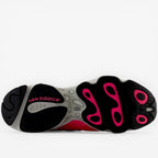 new balance sneaker outsole with black and pink tread, footwear close-up