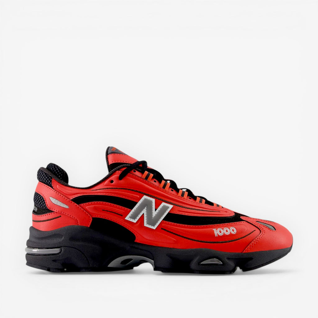 Red and black New Balance sneaker with mesh panels and N logo, athletic footwear for men