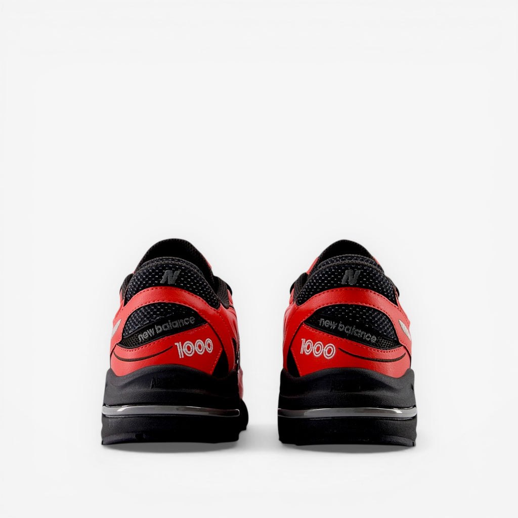 New Balance 1000 red and black sneakers, rear view, athletic footwear