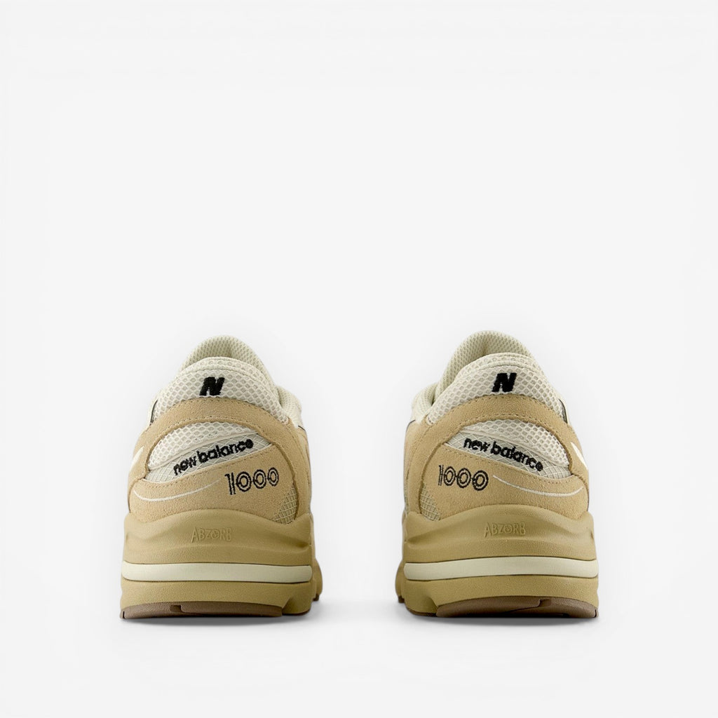 Beige New Balance 1000 sneakers rear view, mesh and suede casual footwear