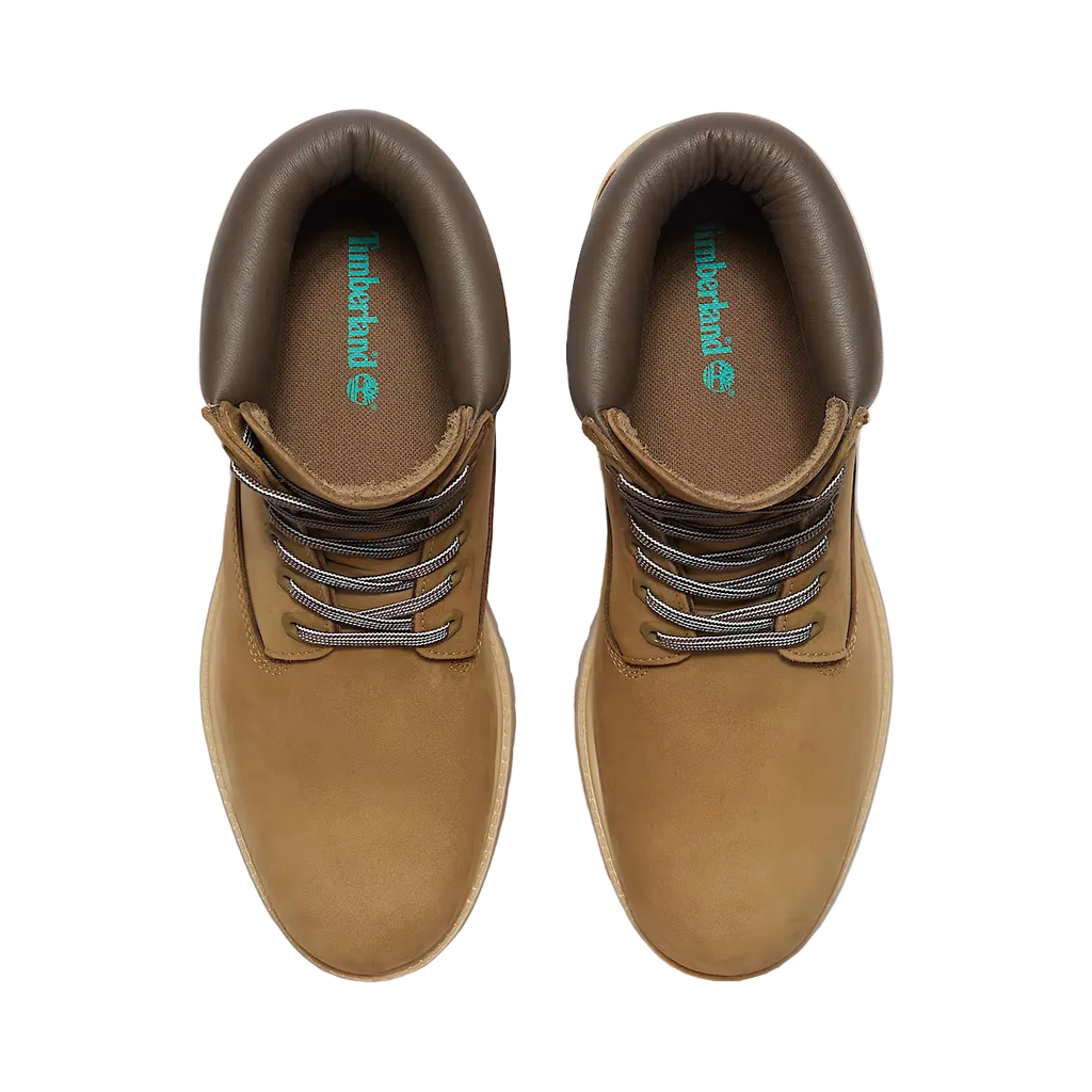 Pair of brown leather boots with laces on a white background