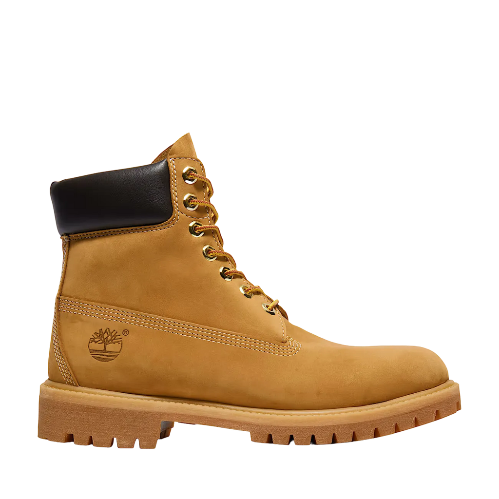 Tan Timberland boot with black top on a white background