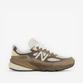 new balance sneaker in tan and cream tones, mesh and suede upper, side profile footwear
