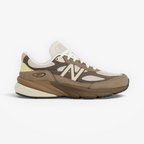 new balance sneaker in tan and cream tones, mesh and suede upper, side profile footwear
