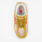 New Balance sneaker in tan, pink, and red, top view, mesh and suede, footwear