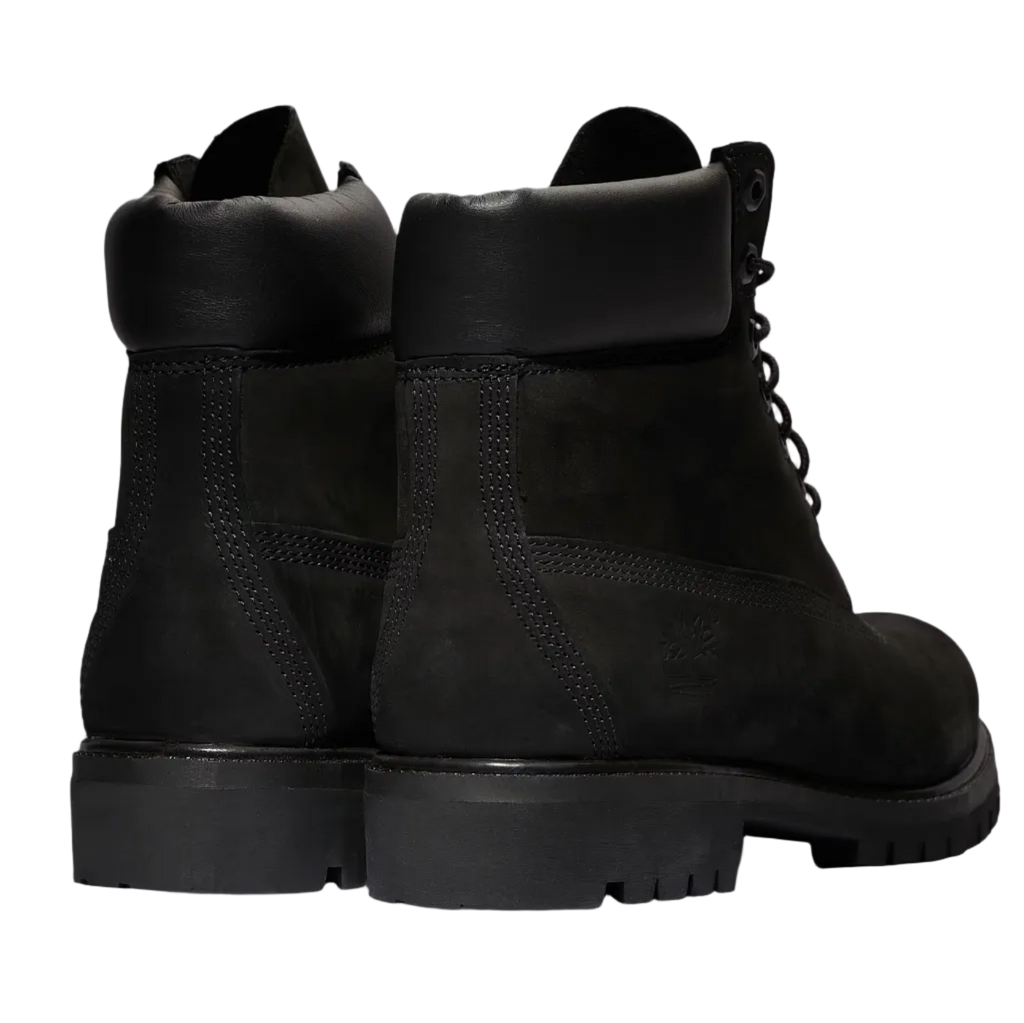 Black leather boots on a white background