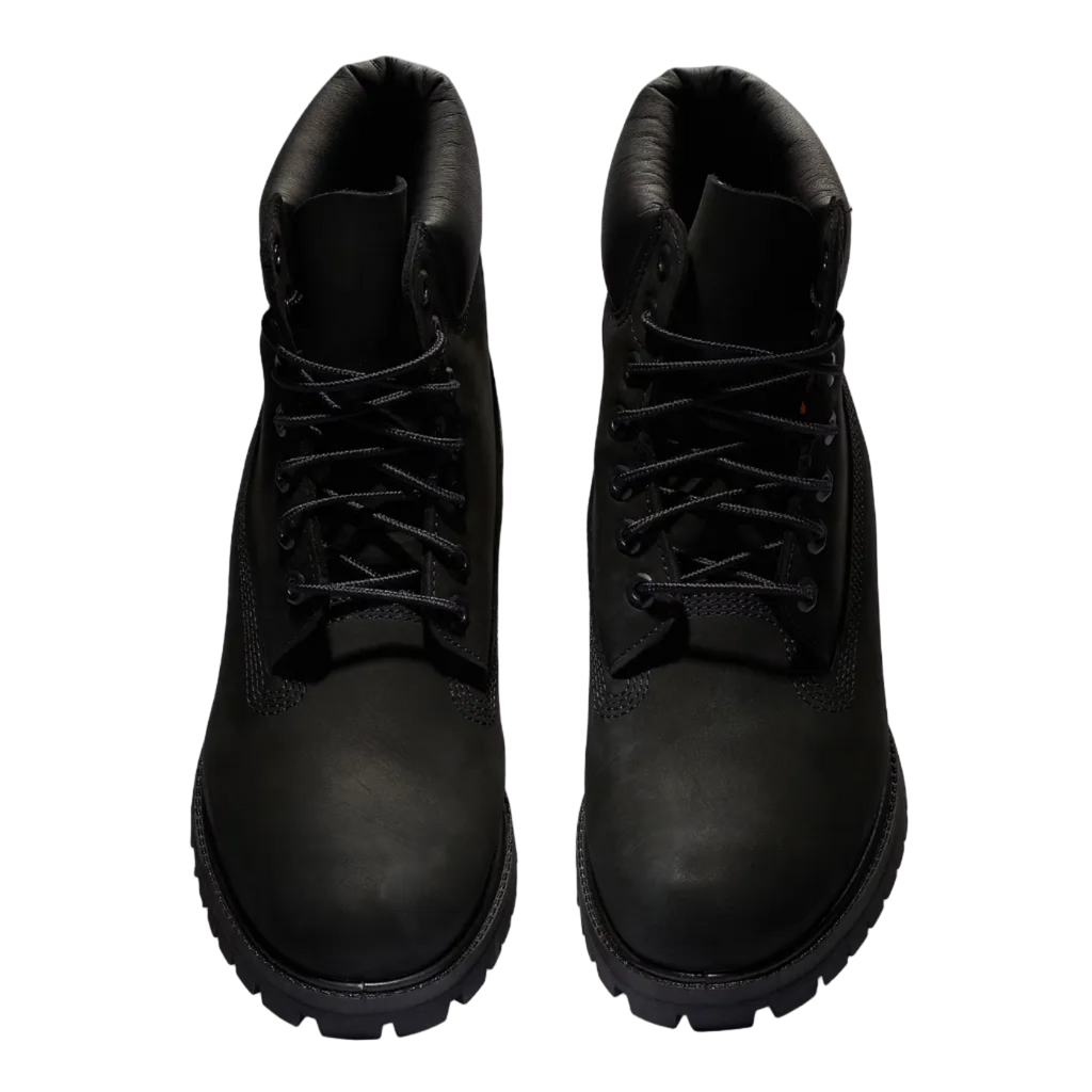 Pair of black leather boots on a white background