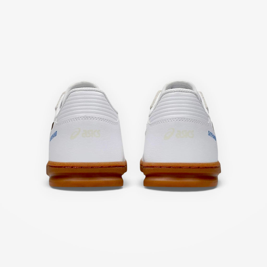 White sneakers with brown soles on a white background