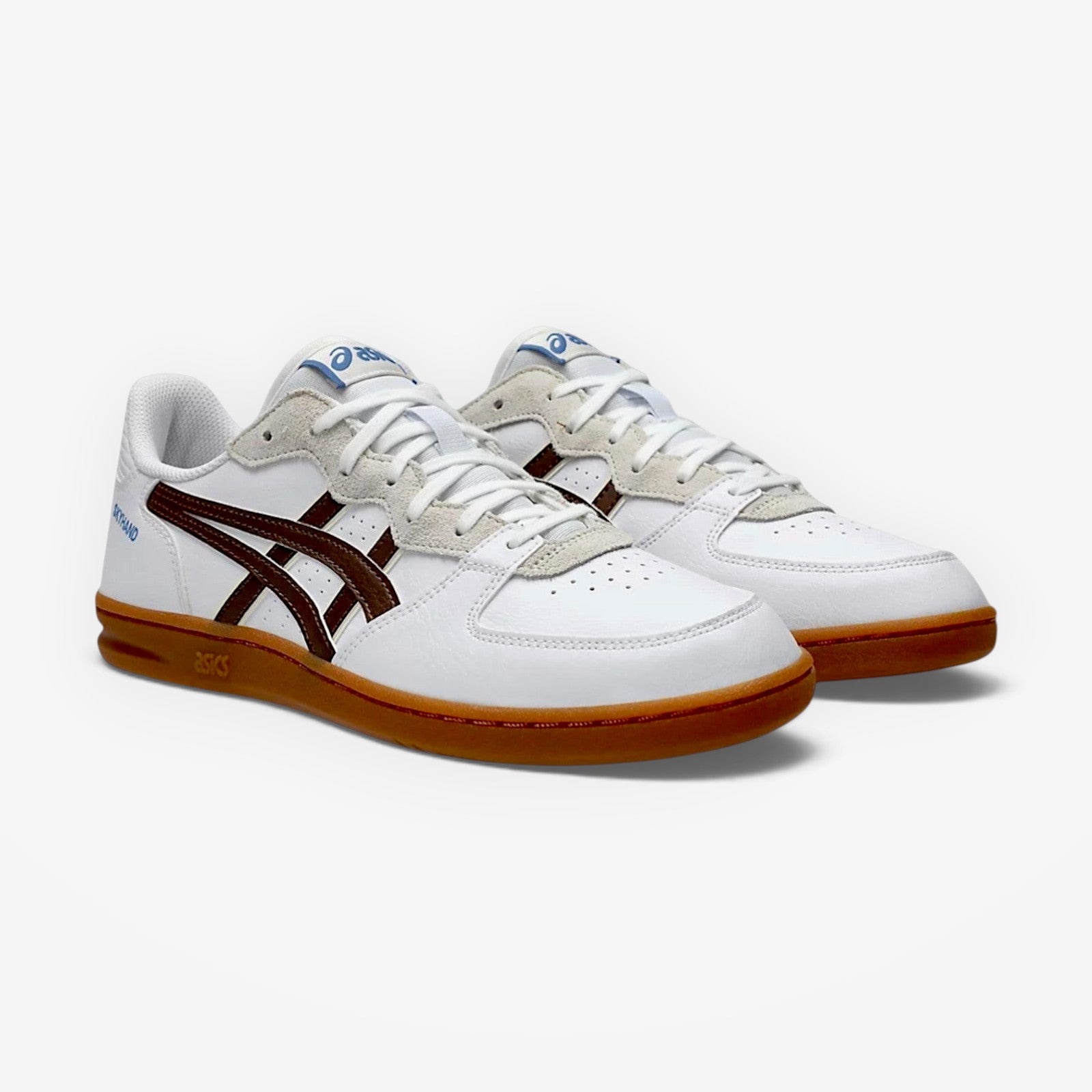 White sneakers with brown soles on a white background