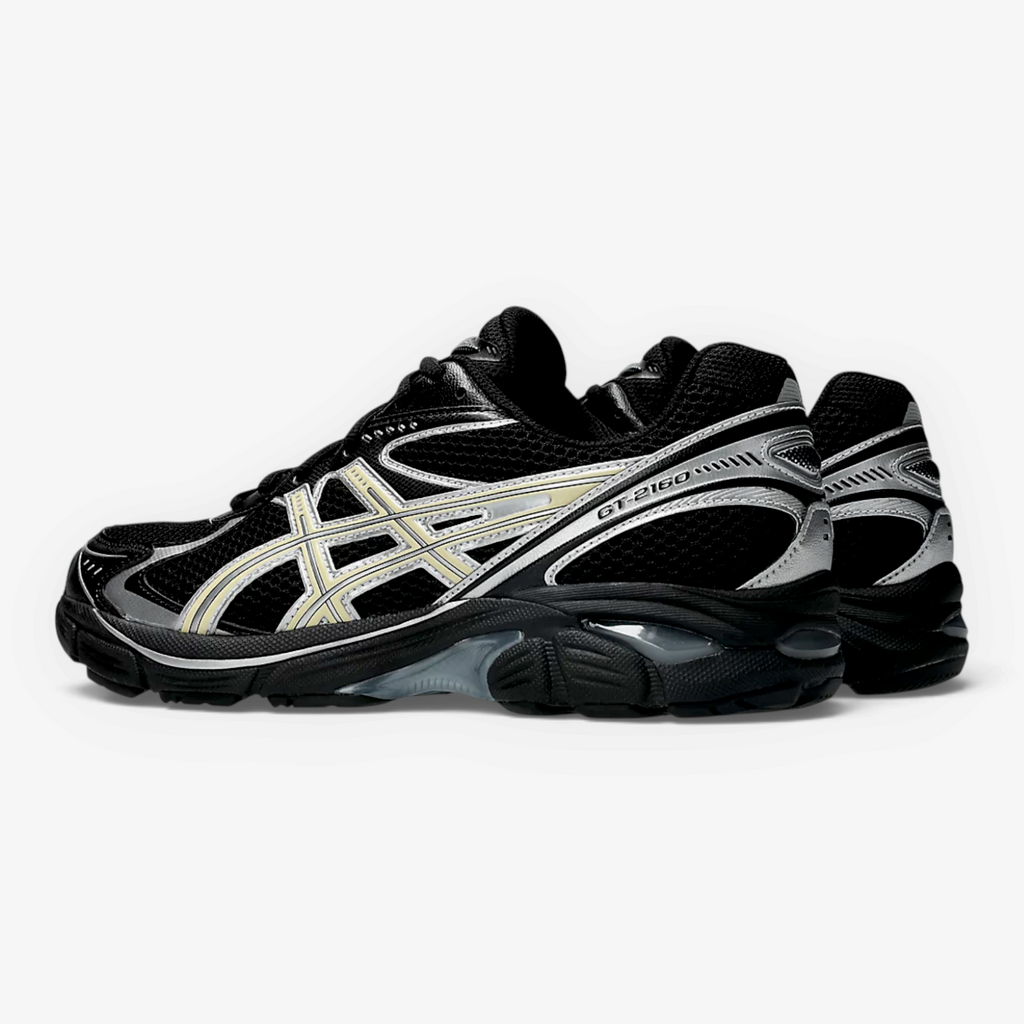 METRO ASICS GT-2160 sneaker in black and beeswax with mesh upper, sculpted forefoot, and GEL cushioning side view.