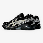 METRO ASICS GT-2160 sneaker in black and beeswax with mesh upper, sculpted forefoot, and GEL cushioning side view.