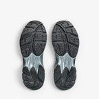 METRO ASICS GT-2160 sneaker outsoles showing black rubber tread pattern and sculpted midsole design