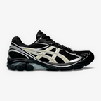 METRO ASICS GT-2160 sneaker in black mesh with beeswax yellow accents and silver detailing, side profile view.