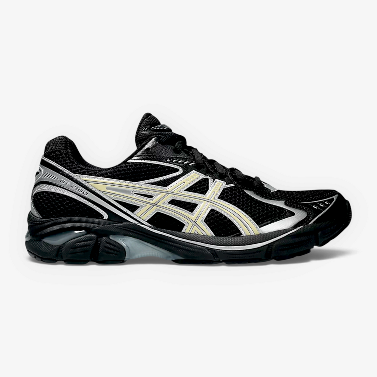 METRO ASICS GT-2160 sneaker in black mesh with beeswax yellow accents and silver detailing, side profile view.