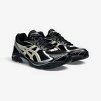METRO ASICS GT-2160 sneakers in black with beeswax yellow accents, featuring mesh panels and GEL cushioning.