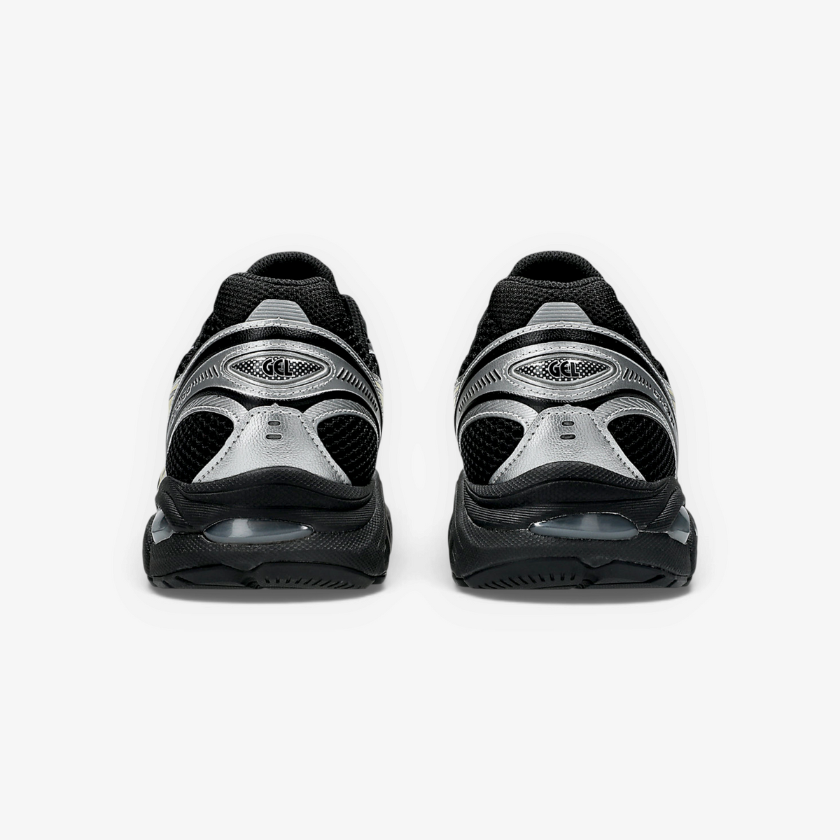 Rear view of METRO ASICS GT-2160 sneakers in black and silver with GEL cushioning and technical mesh detailing.