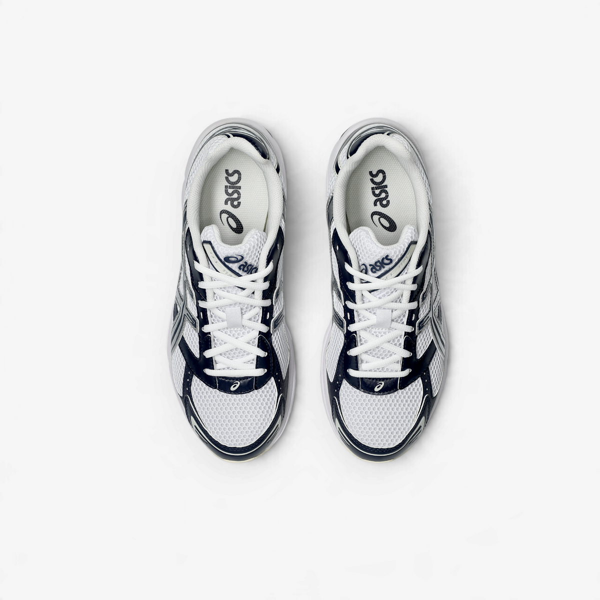METRO ASICS GEL-1130 retro running shoes in white and midnight blue with a layered mesh upper and heel cushioning.