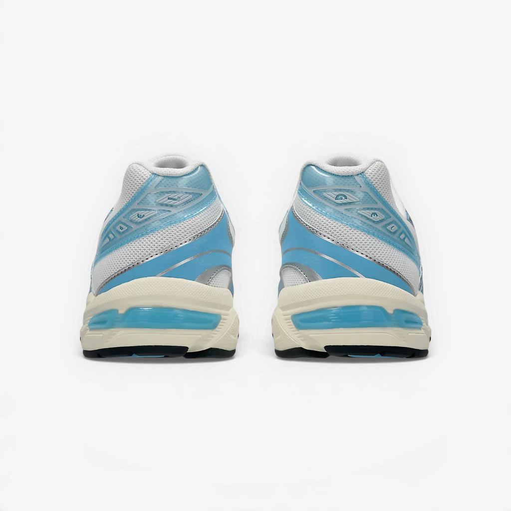 Rear view of METRO ASICS GEL-1130 sneakers in white and storm cloud blue with glossy TPU heel details