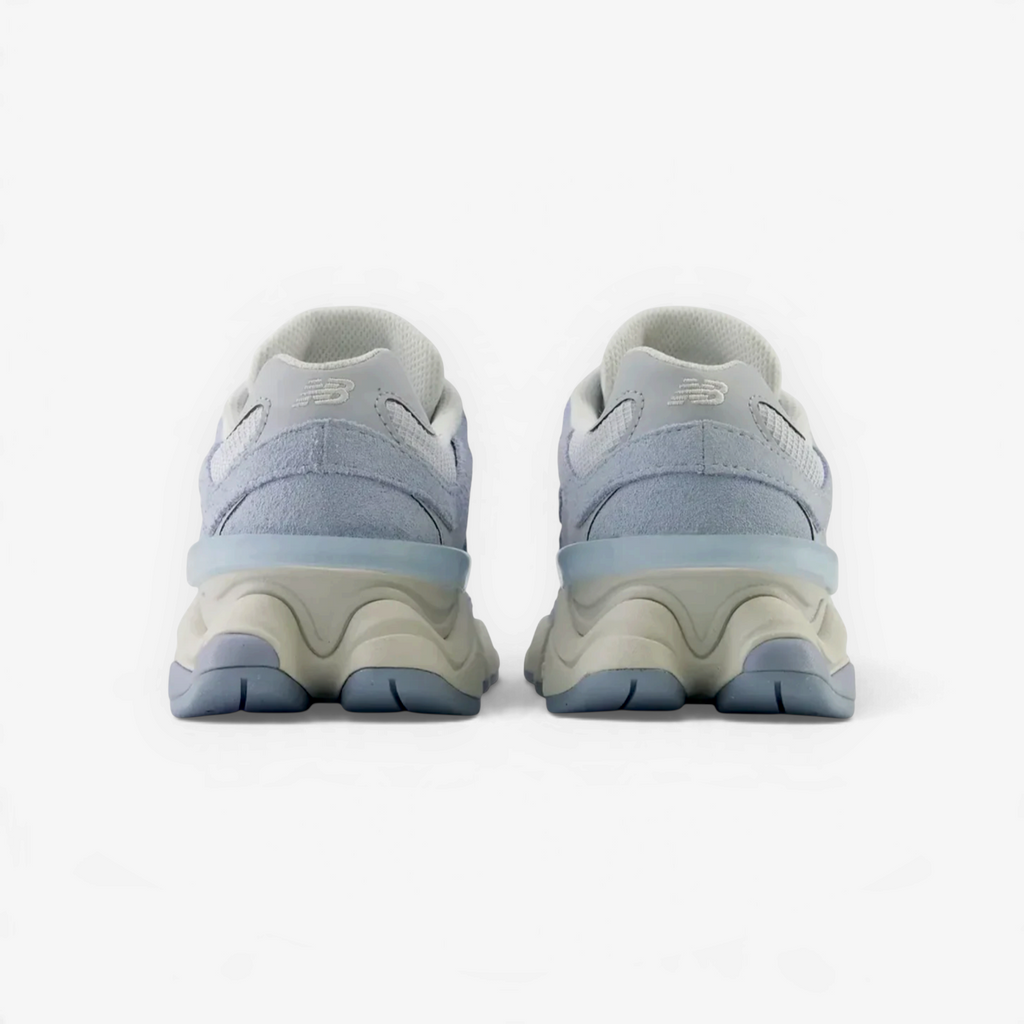 METRO New Balance 9060 sneakers in vintage indigo and pumpernickel, showing the chunky heel and sculpted sole design.