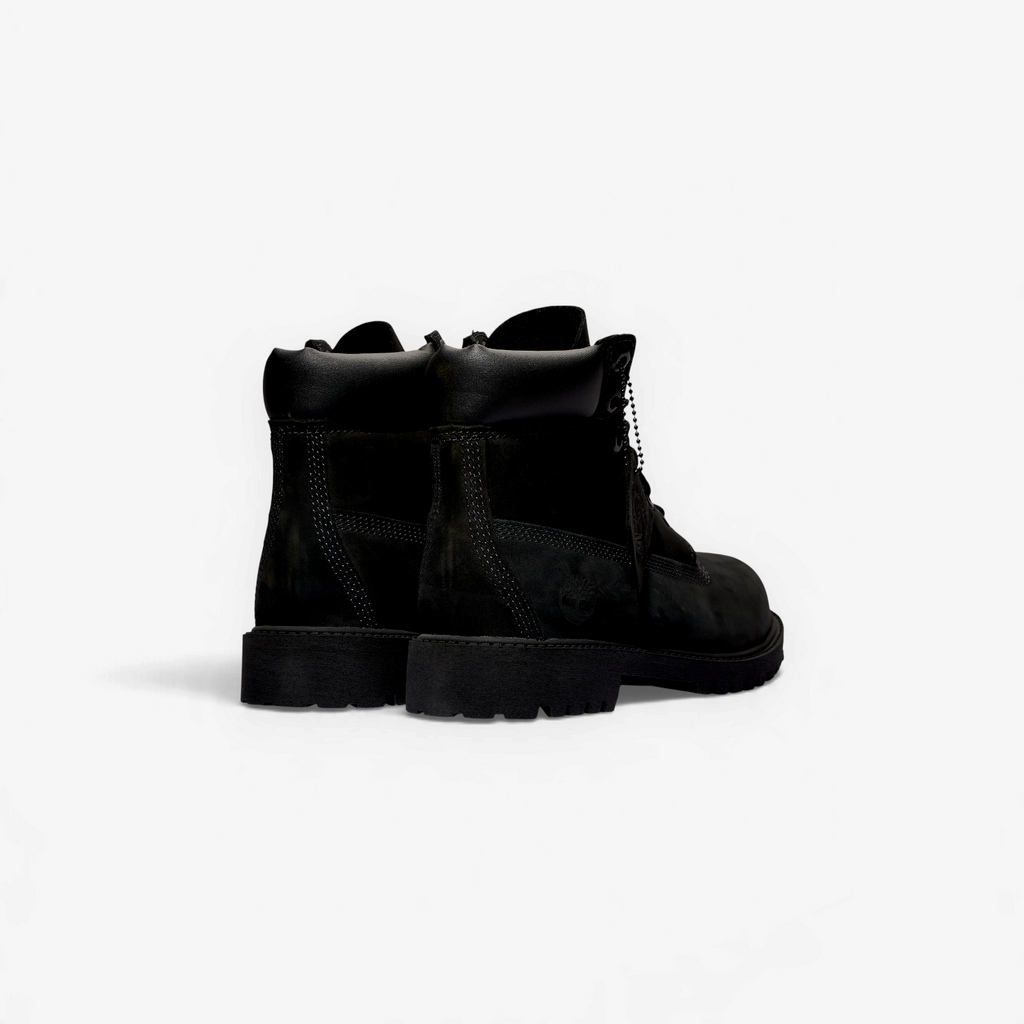 METRO Timberland kids' black waterproof 6-inch premium leather boots, rear view showing padded collar and lug sole.