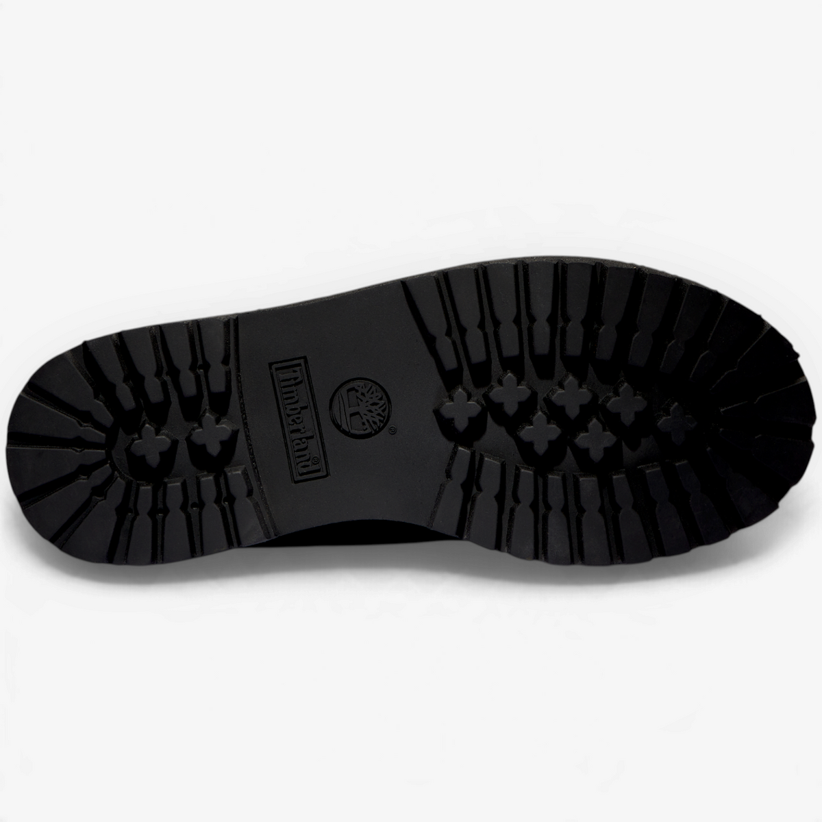 METRO Timberland kids' black waterproof boot showing the rugged rubber lug sole tread pattern from below