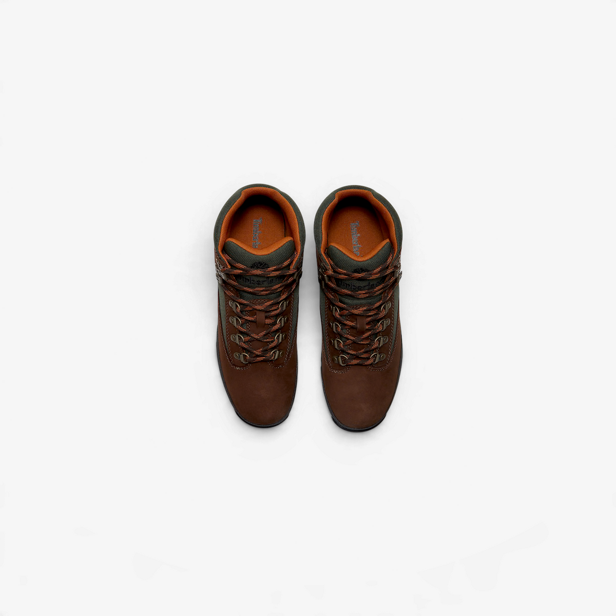 METRO Timberland Euro Hiker boots in dark brown nubuck leather with green accents and speed-lace hardware, top view.