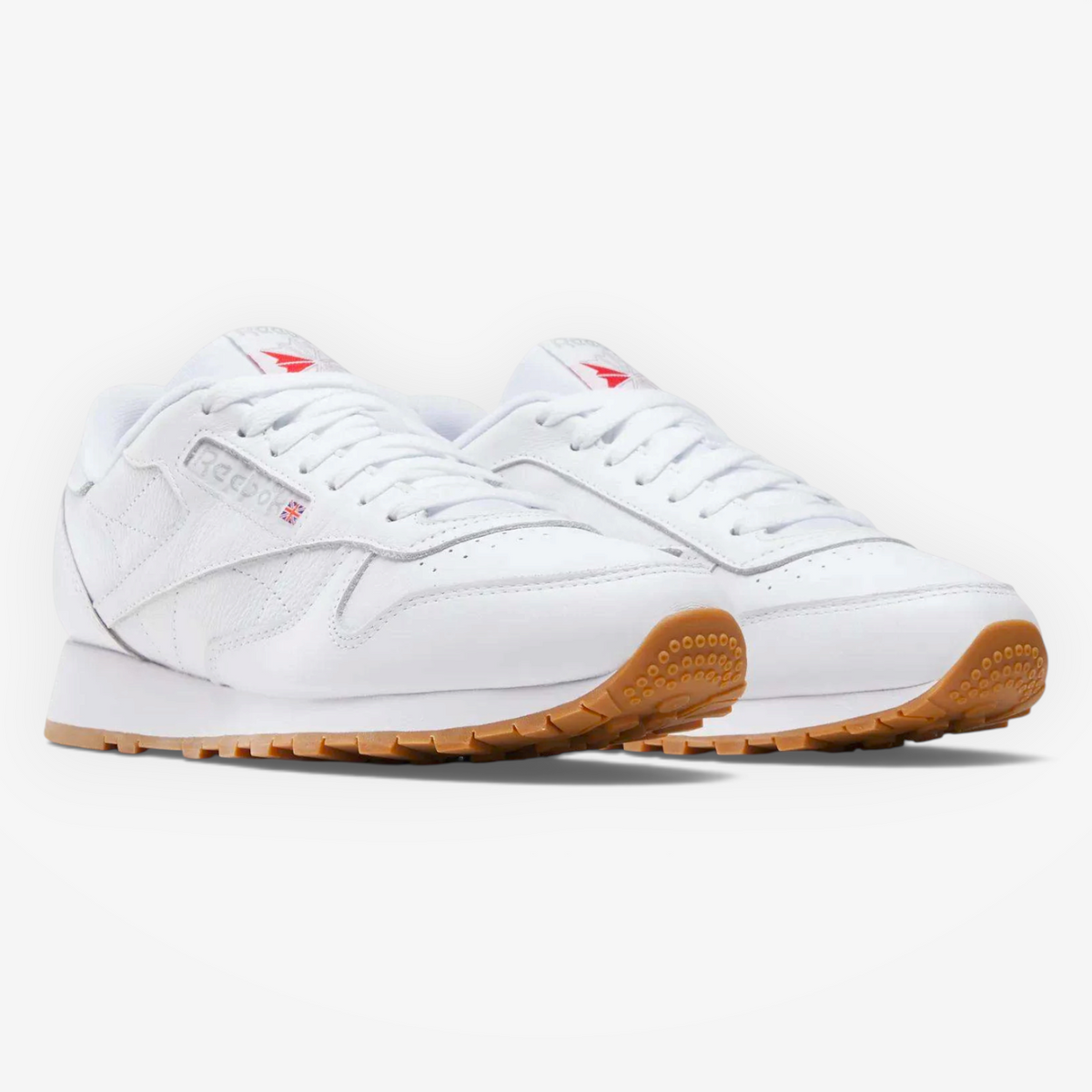 METRO Reebok Classic Leather sneakers in white leather with grey accents and a gum rubber outsole.