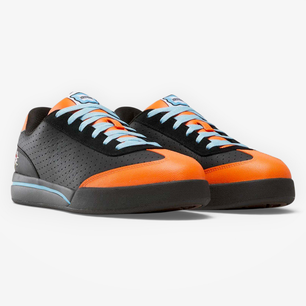 METRO Reebok x ICECREAM Board Flip low-cut skate sneakers in black, orange, and blue suede with perforated details.