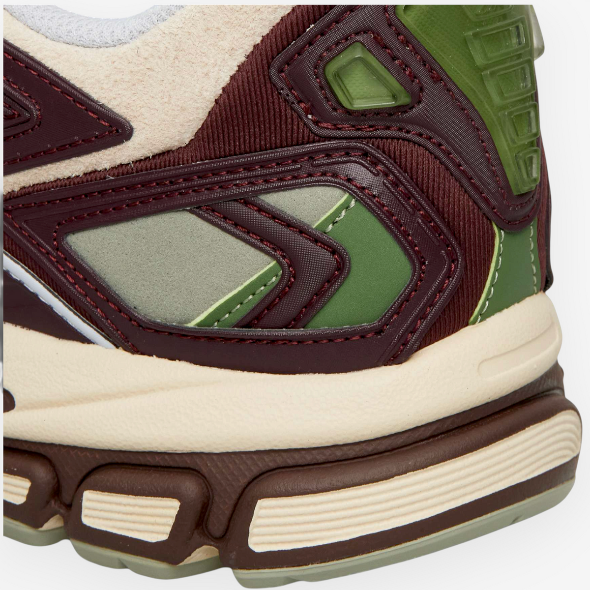 Close-up of METRO Reebok Premier Road Ultra sneaker featuring dark cocoa, tranquil blue, and vintage chalk panels.