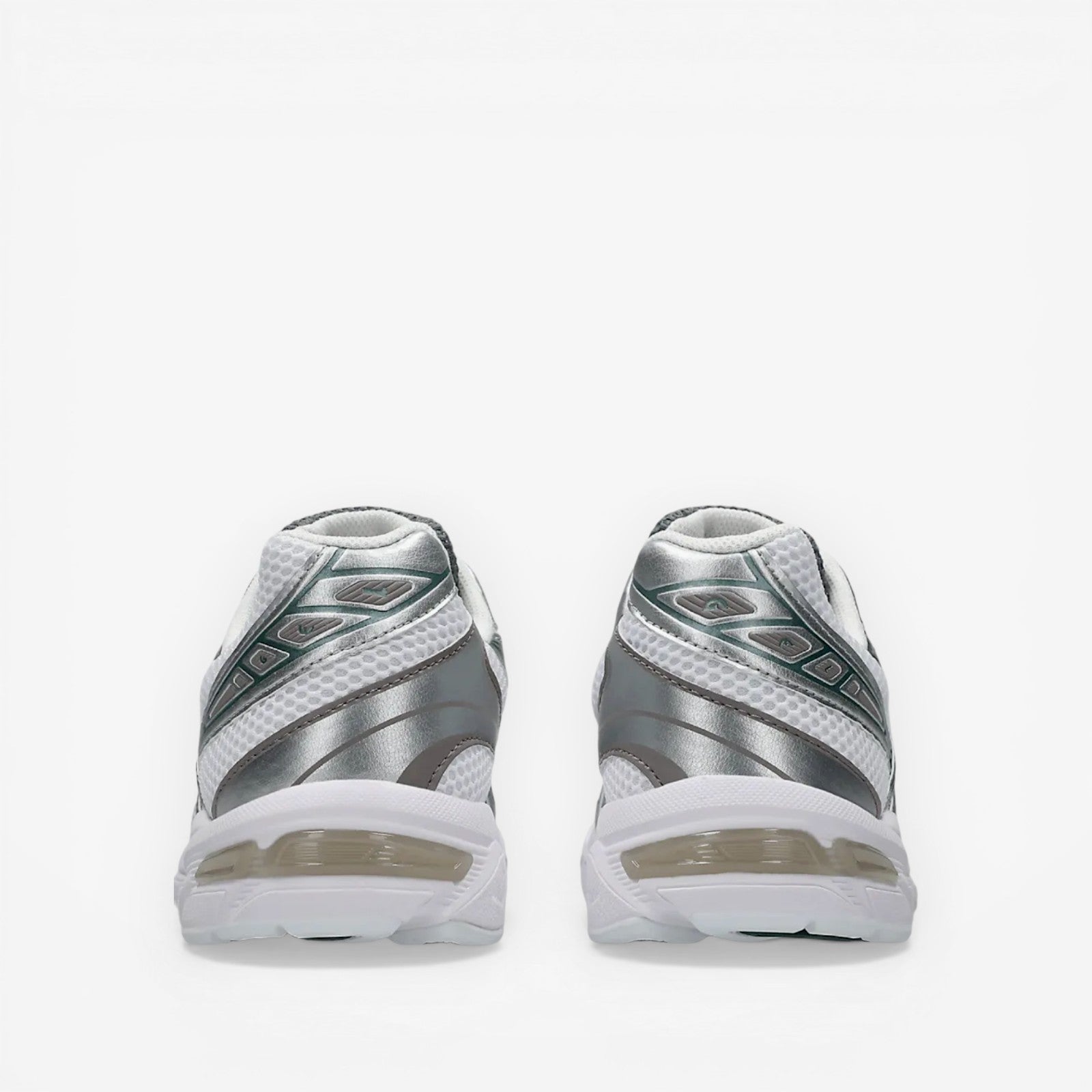 Back view of silver and white New Balance Asics sneakers, mesh and metallic detailing