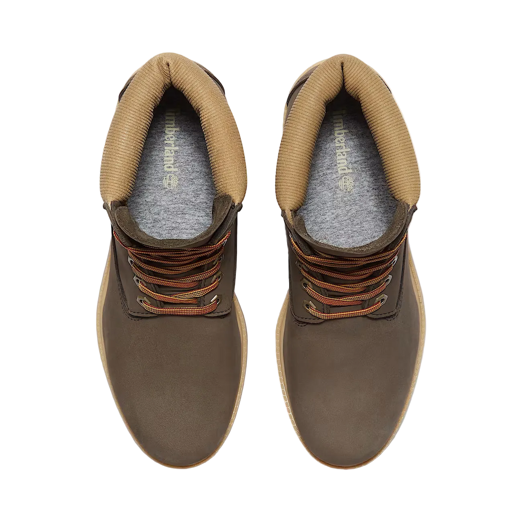 Brown leather boots with orange laces on a white background