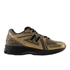 Gold and black New Balance sneaker with mesh upper and black sole, stylish footwear