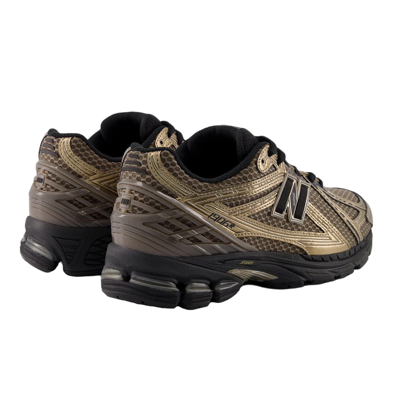 New Balance sneakers in metallic gold and black, stylish footwear for sneaker enthusiasts