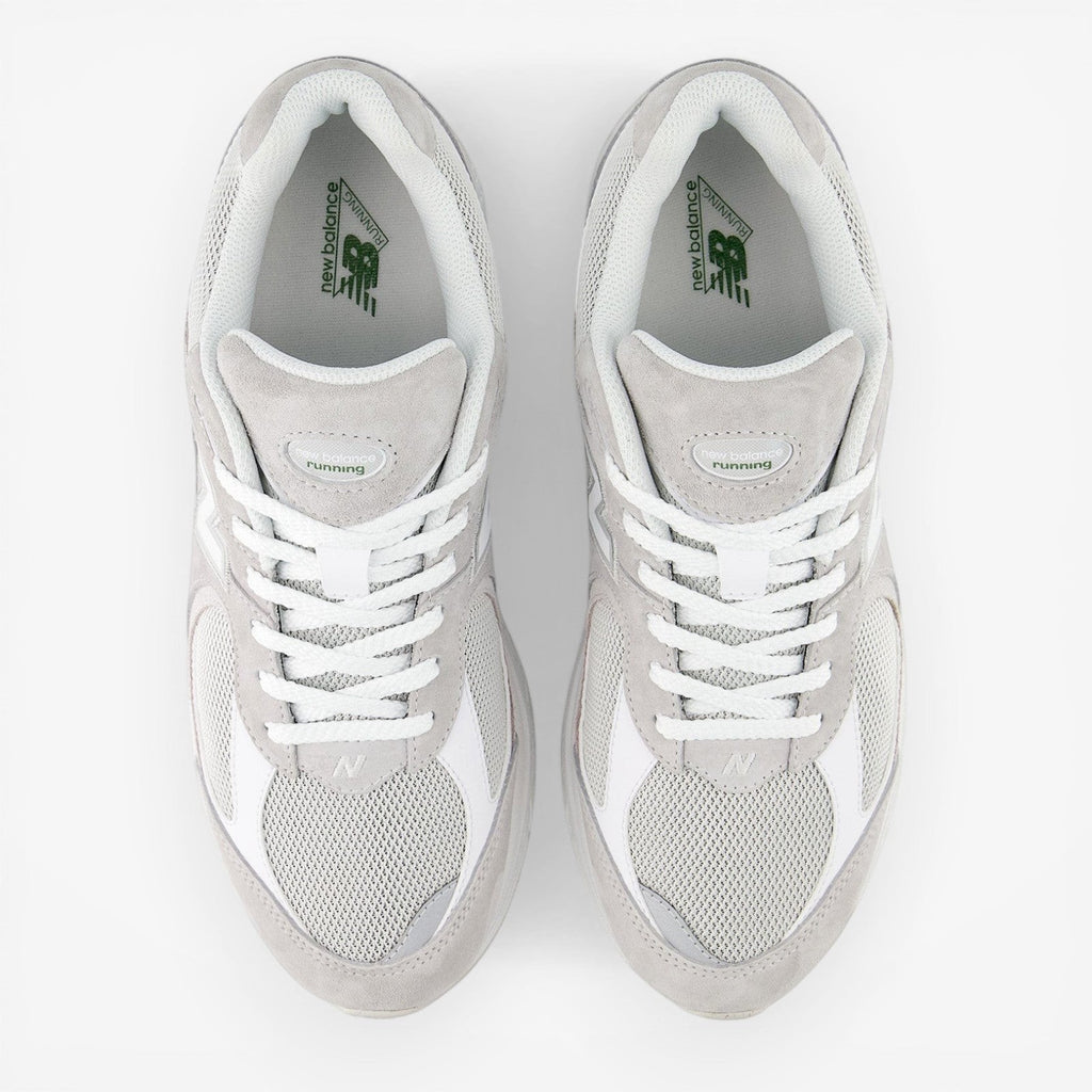 new balance grey and white sneakers with mesh and suede upper, top view, footwear