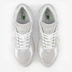 new balance grey and white sneakers with mesh and suede upper, top view, footwear
