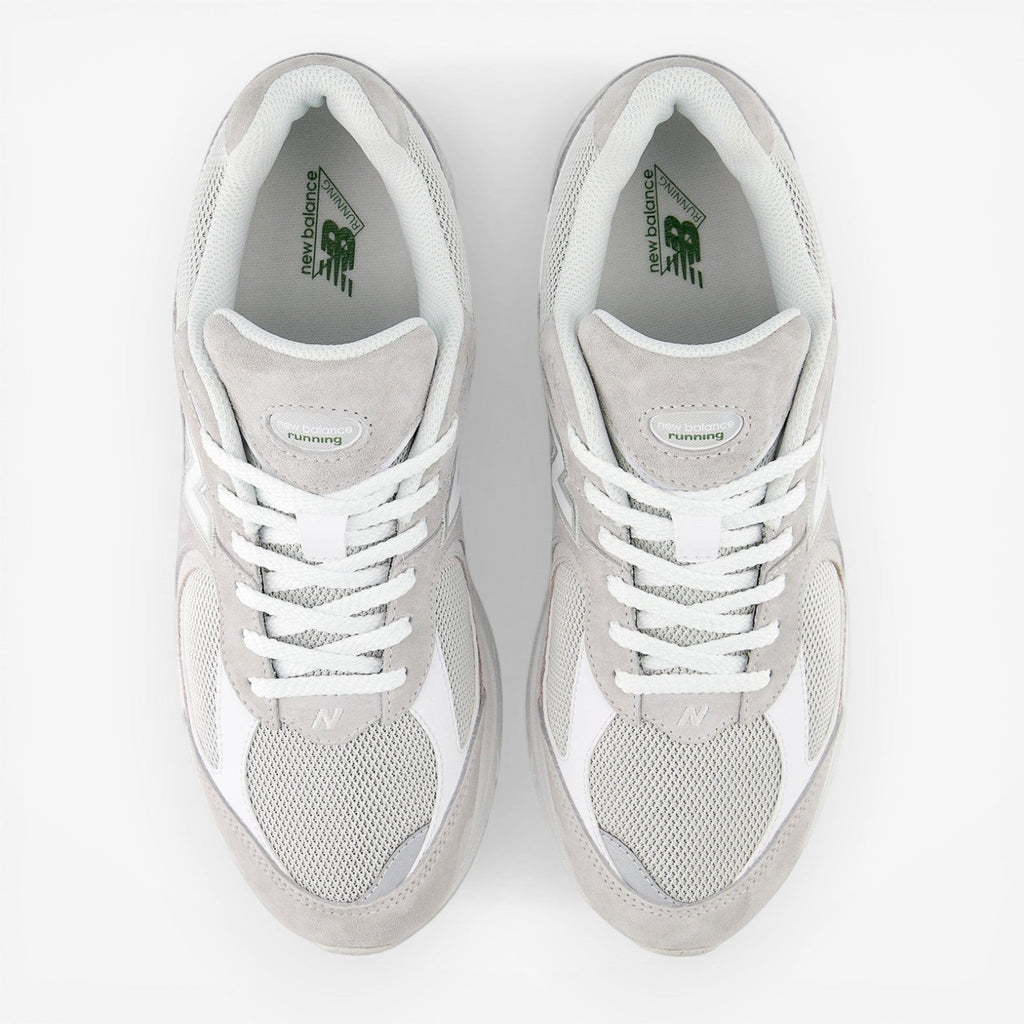 new balance grey and white sneakers with mesh and suede upper, top view, footwear